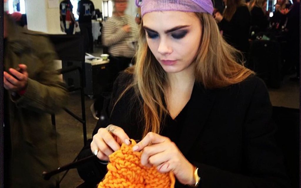 Surprise marketplace niches in the craft world show xposurephotos photo of Cara Delevigne knitting